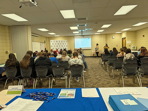 Students and community members in a conference room