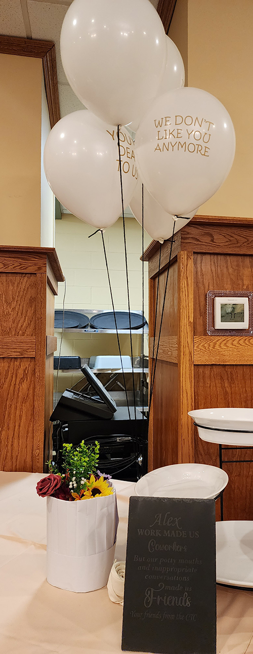 White balloons and flowers for Mr. Johnson