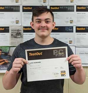 Levi Howard holding his TestOut PC Pro award