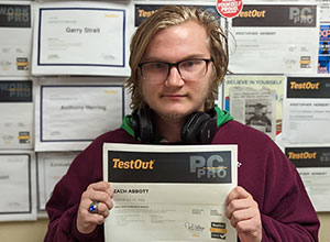 Zachery holding his certificate